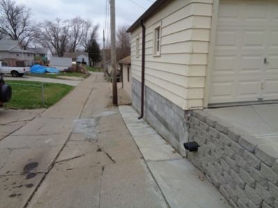Cracking sidewalk because of water issues Quality Foundation Repair serving Benson, Nebraska