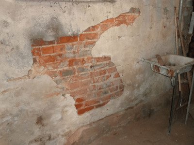 Deteriorating mortar joints in brick or stone foundation